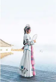  ?? ?? A portrait of a young woman in traditiona­l attire for a theatre performanc­e In Zhejiang, China.