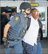  ?? Picture: FREDLIN ADRIAAN ?? SPEEDY EXIT: Bishop Tim Omotoso is arrested at the Port Elizabeth Airport