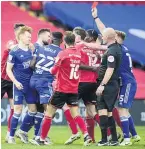  ??  ?? BLUE AND RED Ipswich’s Jon Nolan, third left, is shown the red card against Lincoln