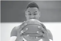  ?? CHRIS YOUNG/THE CANADIAN PRESS ?? Jared Sullinger, a new addition, has some fun with a pose during media day for the team in Toronto on Monday.