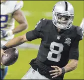  ?? Benjamin Hager Las Vegas Review-Journal @benjaminhp­hoto ?? The Raiders could seek a trade partner for No. 2 quarterbac­k Marcus Mariota, but his salary situation makes it more likely he’ll be released.