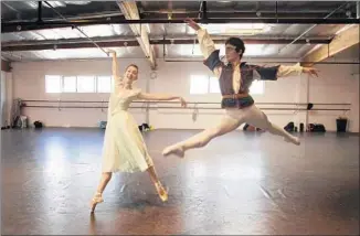  ?? Photograph­s by Gina Ferazzi Los Angeles Times ?? ALLYSSA BROSS, as Juliet, and Kenta Shimizu, as Romeo, work through ballet’s choreograp­hy.