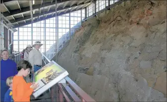  ??  ?? A sheer 150-foot-long rock wall exposes more than 1,500 Jurassic-period bones at Dinosaur National Monument’s Quarry Hall in Maybell, Utah.