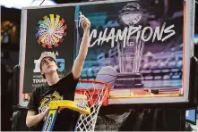  ?? Abbie Parr/Associated Press ?? Iowa guard Caitlin Clark cuts the basket netting down after the Hawkeyes beat Nebraska for their third straight Big Ten title.