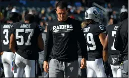  ?? JOSE CARLOS FAJARDO/TRIBUNE NEWS SERVICE ?? Injured Oakland Raiders quarterbac­k Derek Carr paces the bench during Oakland's loss to the Ravens at the Coliseum in Oakland on Oct. 8. Carr is expected back on Sunday.