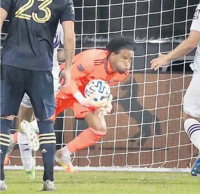  ?? /STEPHEN M. DOWELL/ORLANDO SENTINEL ?? Orlando City goalkeeper Pedro Gallese makes a save during the MLS is Back Tournament game against the Philadelph­ia Union Monday.