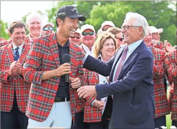  ?? AP - Richard W. Rodriguez, file ?? Kevin Na is congratula­ted by Charles Schwab after winning last year’s Colonial in Fort Worth, Texas. The PGA Tour laid out a plan to resume its season June 11-14 at Colonial, while also keeping fans away for at least the first month.