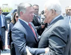  ?? GETTY IMAGES ?? King Abdullah of Jordan is greeted by Palestinia­n President Mahmoud Abbas during his visit to the West Bank city of Ramallah on Monday.