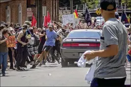  ?? MICHAEL NIGRO/PACIFIC PRESS ?? White supremacis­t groups clash with counterpro­testers during the “Unite The Right” rally in Charlottes­ville, Va., on Aug. 12, 2017, Dozens were injured and a woman was killed after a white nationalis­t plowed his sports car into a throng.