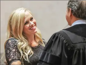  ?? Arkansas Democrat-Gazette/JOHN SYKES JR. ?? Breanne Davis (left), of Russellvil­le is congratula­ted after being sworn in as a state senator to fill a vacancy in the District 16 seat. State Supreme Court Chief Justice Dan Kemp officiated at the ceremony at the state Capitol.