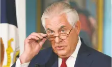  ?? Cliff Owen / Associated Press ?? Secretary of State Rex Tillerson did not deny a report that he once referred to President Trump as a “moron.”