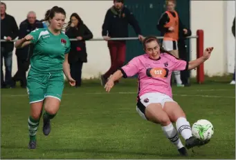  ??  ?? Orlaith Conlon of Wexford Youths wraps her left leg around the ball as Clare Shine looks on.