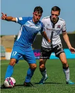  ??  ?? TUSSLE: Dan Hawkins of Finn Harps holds off Raivis Jurkovskis of Dundalk yesterday