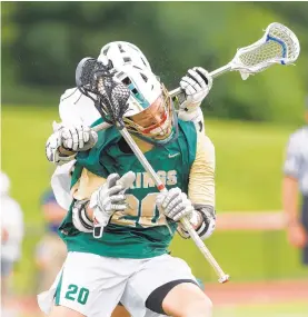  ??  ?? Allentown Central Catholic’s Tyler Schifko is checked by Mars’ Aiden Moffa on Saturday. Allentown Central Catholic went 2-0 in the EPC playoffs, 3-0 in the District 11 postseason and 4-0 in the state tournament.