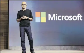  ?? RICHARD DREW / ASSOCIATED PRESS ?? Microsoft CEO Satya Nadella gives a presentati­on Tuesday in New York about the tech company’s newest devices. The company, which is launching a new laptop, tablet and phones, is trying to “move people from needing Windows to choosing Windows to loving...