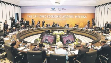  ?? — AFP photo ?? Photo shows APEC leaders attending the APEC Economic Leaders’ Meeting, part of the APEC leaders’ summit in the central Vietnamese city of Danang. Leaders of 21 member states of the APEC have reaffirmed their long-standing commitment to APEC’s mission...