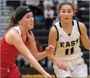  ?? TIMOTHY ARRICK — FOR MEDIANEWS GROUP ?? Junior Ella Kruschka, right, is one of the top returning players for South Lyon East in the 2021girls basketball season. She has the Cougars off to a 2-1start thus far.