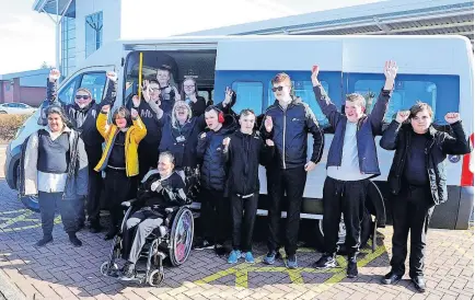  ?? ?? Delighted Pupils celebrate getting the new mini bus