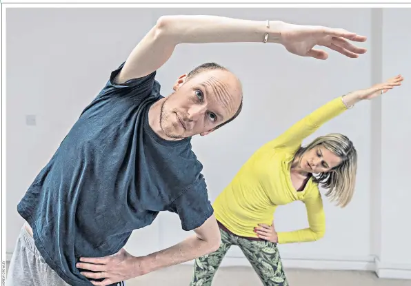  ??  ?? Stretching boundaries: Joe Shute, the Daily Telegraph writer, with Sam Webster, his pilates teacher