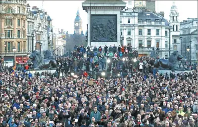  ?? MATT DUNHAM / ASSOCIATED PRESS ?? Crowds gather in London’s Trafalgar Square for a vigil for the victims of Wednesday’s attack, which resulted in the deaths of five people.