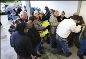  ?? Arkansas Democrat-Gazette/STATON BREIDENTHA­L ?? Customers look at the menu of products available outside Doctors Orders Rx medical marijuana dispensary in Hot Springs on May 11, the first day sales were legal in Arkansas. The legalizati­on of medical marijuana in 2016 is one of 20 times the state constituti­on has been changed in the past seven elections.