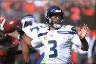  ?? DAVID RICHARD - THE ASSOCIATED PRESS ?? Seattle Seahawks quarterbac­k Russell Wilson looks to pass during the first half of an NFL football game against the Cleveland Browns, Sunday, Oct. 13, 2019, in Cleveland.