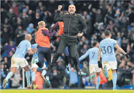  ??  ?? Manchester City manager Pep Guardiola celebrates his team’s goal during a recent English Premier League game.