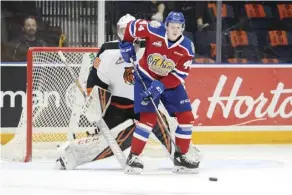  ?? RYan MCCraCKEn ?? Oil Kings winger Carter Souch looks to tip a puck past Tigers goalie Mads Sogaard during Game 3 action in Medicine Hat.