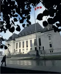  ?? THE CANADIAN PRESS FILES ?? A pedestrian walks past the Supreme Court of Canada in Ottawa, Oct. 18, 2013. A ruling from Canada’s top court says that records detailing the abuse of former residentia­l school students can eventually be destroyed.