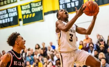  ?? Michael M. Santiago/Post-Gazette ?? Quaker Valley’s Adou Thiero rises for a layup past New Castle’s Mike Graham.