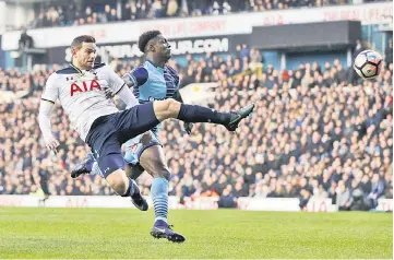  ??  ?? Wycombe Wanderers’ Anthony Stewart in action with Tottenham’s Vincent Janssen. — Reuters photo
