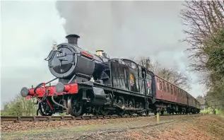  ?? JAMES KINDRED ?? No. 4277 Hercules begins the climb towards Kelling Heath after departing Weybourne on February 17, with a train from Sheringham to Weybourne.