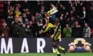  ?? ?? Emmanuel Dennis acrobatica­lly celebrates scoring Watford’s second goal. Photograph: Alex Pantling/Getty Images