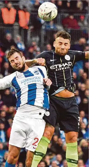  ?? AFP PIC ?? Brighton’s Davy Propper (left) vies with Manchester City’s Nicolas Otamendi in their FA Cup semi-final match on Saturday.