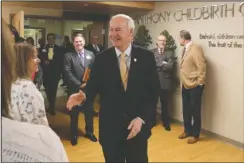  ?? The Sentinel-Record/Richard Rasmussen ?? CENTER OPENING: Arkansas Gov. Asa Hutchinson makes his way into the new CHI St. Vincent Hot Springs Anthony Childbirth Center on Monday.