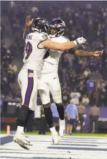  ?? Marcio Jose Sanchez / Associated Press ?? Ravens tight end Mark Andrews (left) celebrates with quarterbac­k Lamar Jackson after scoring on a 68-yard pass.