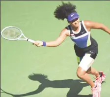  ??  ?? Japan’s Naomi Osaka prepares to play a forehand during her match against Marta Kostyuk at the U.S Open yesterday. (Reuters photo)