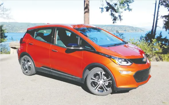  ?? PHOTOS: ANDREW MCCREDIE ?? In addition to an increase in battery range, the 2020 Chevrolet Bolt comes in a number of new exterior colours, including Cayenne Orange Metallic.