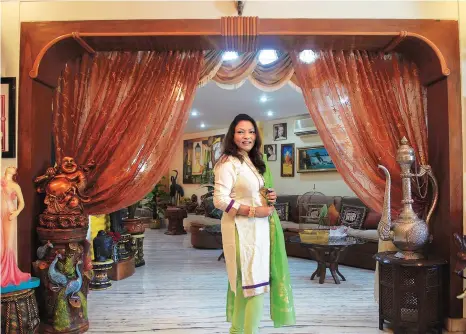  ?? KAMLESH PEDNEKAR ?? Kalpana Saroj in her 5,000-squarefeet house at Ulhasnagar near Mumbai which is adorned with flowers, potted plants, glittering curtains and paintings