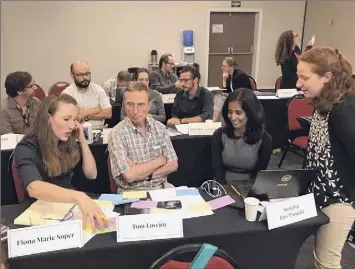  ?? Skidmore College ?? Zoe Pagliaro, a 2020 Skidmore College graduate, far right, speaks with researcher­s from other schools and universiti­es at a 2019 summit in Manaus, Brazil.