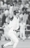  ??  ?? Arizona Diamondbac­ks’ Luis Gonzalez celebrates driving in the winning run in the ninth inning of Game 7 of the World Series against the New York Yankees in Phoenix, less than two months after the terrorist attacks knocked down the World Trade Center towers, 17 years ago Sunday.