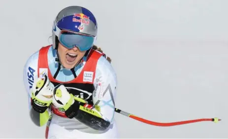  ?? FRANCIS BOMPARD/GETTY IMAGES ?? Lindsey Vonn celebrates her victorious run at Sunday’s World Cup Super-G race in Cortina d’Ampezzo, Italy. Canada’s Larisa Yurkiw was 12th.