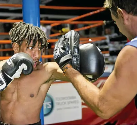  ?? PHOTO: NEV MADSEN ?? HARD WORK: Brendon Smith (right) puts Jeddy Kalambe through his paces during a training session.