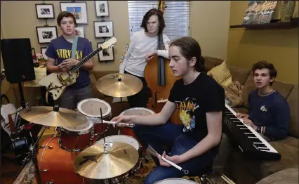  ?? Cliff Grassmick / Staff Photograph­er ?? From left, Brody Mundt, Ben Egan, Dylan Luther and Simon Von Hatten make up “The Blue Shoes,” a group of high school students from Longmont that will be performing at a blues festival in Memphis.