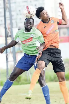  ??  ?? Tivoli Gardens’ Romaine Brakenridg­e (right) and Montego Bay United’s Dino Williams battle for possession of the ball during their Red Stripe Premier League football match at the Edward Seaga Sports Complex on Sunday, February 25, 2018.