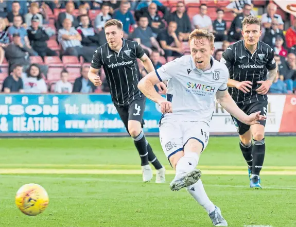  ??  ?? Danny Johnson, above, hits home Dundee’s first goal from the penalty spot; Kevin Nisbet, right, makes it 2-0 to Dunfermlin­e. Picture: SNS.