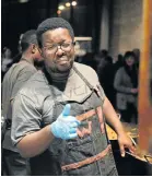  ?? Picture: BRIAN WITBOOI ?? ALL HANDS ON FIRE: Abongile Ngalonkulu cooks up a storm at the Goodnight Market at the Tramways Building last week