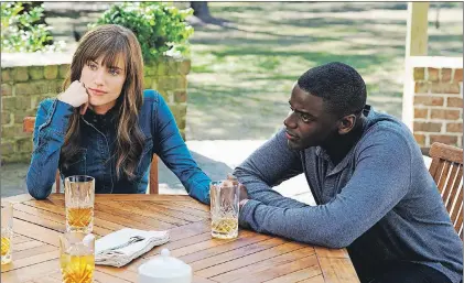  ?? JUSTIN LUBIN/UNIVERSAL PICTURES VIA AP ?? This image released by Universal Pictures shows Allison Williams (left) and Daniel Kaluuya in a scene from “Get Out.”