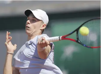  ?? AURELIEN MORISSARD, THE ASSOCIATED PRESS ?? Canada’s Denis Shapovalov hits a shot against American Brandon Nakashima during their first-round match at the French Open in Paris on Monday.