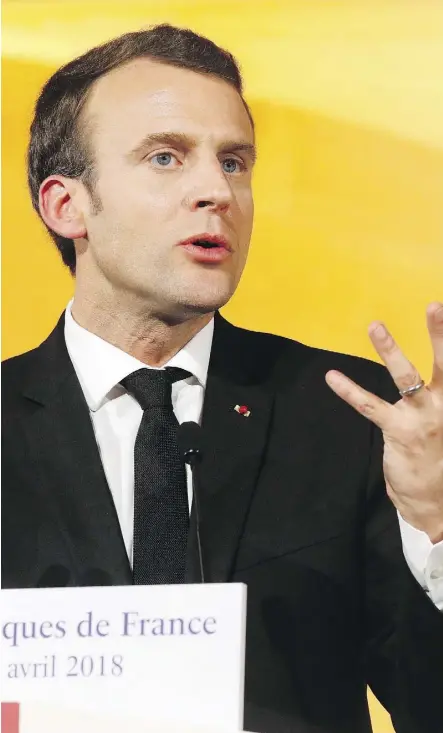  ?? LUDOVIC MARIN, POOL VIA AP ?? French President Emmanuel Macron vowed to continue with his controvers­ial train reforms despite public anger. The measure is part of his economic plan, which critics say is favouring the rich.